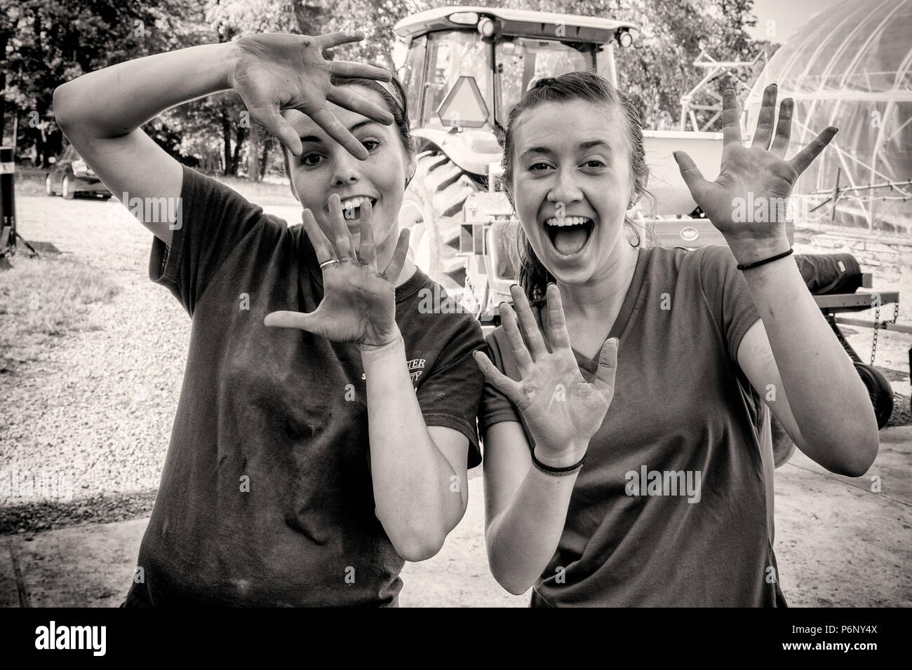 Two women showing their dirty hands from farm work Stock Photo