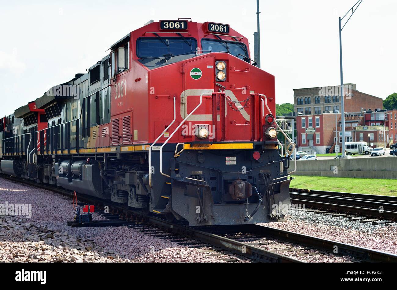 Dubuque, Iowa, USA. Lead units of a Canadian National Railway freight train just after it exited a freight yard. Stock Photo