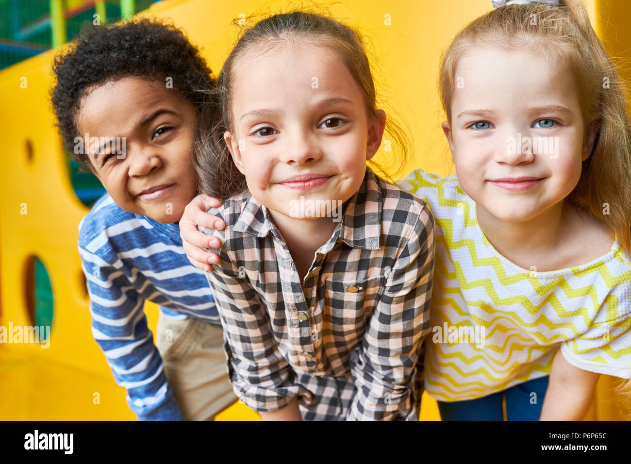 Happy Children Looking at Camera in Play Center Stock Photo