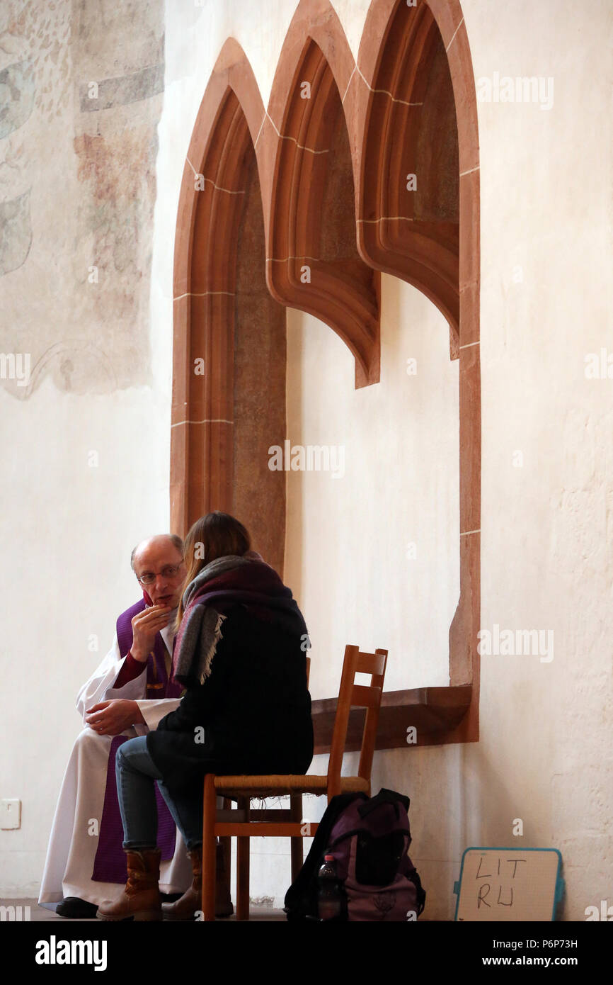 Leonhardskirche.   European Youth meeting of Taize in Basel.  Sacrament of reconciliation.  Basel. Switzerland. Stock Photo