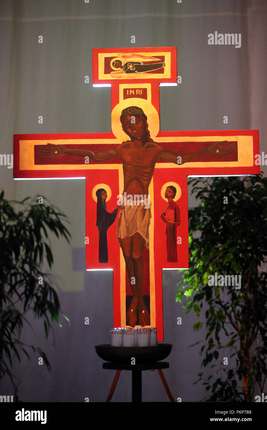 St Jakobshalle. European Youth meeting of Taize in Basel. Icon cross of  Taize with Jesus. Basel. Switzerland Stock Photo - Alamy