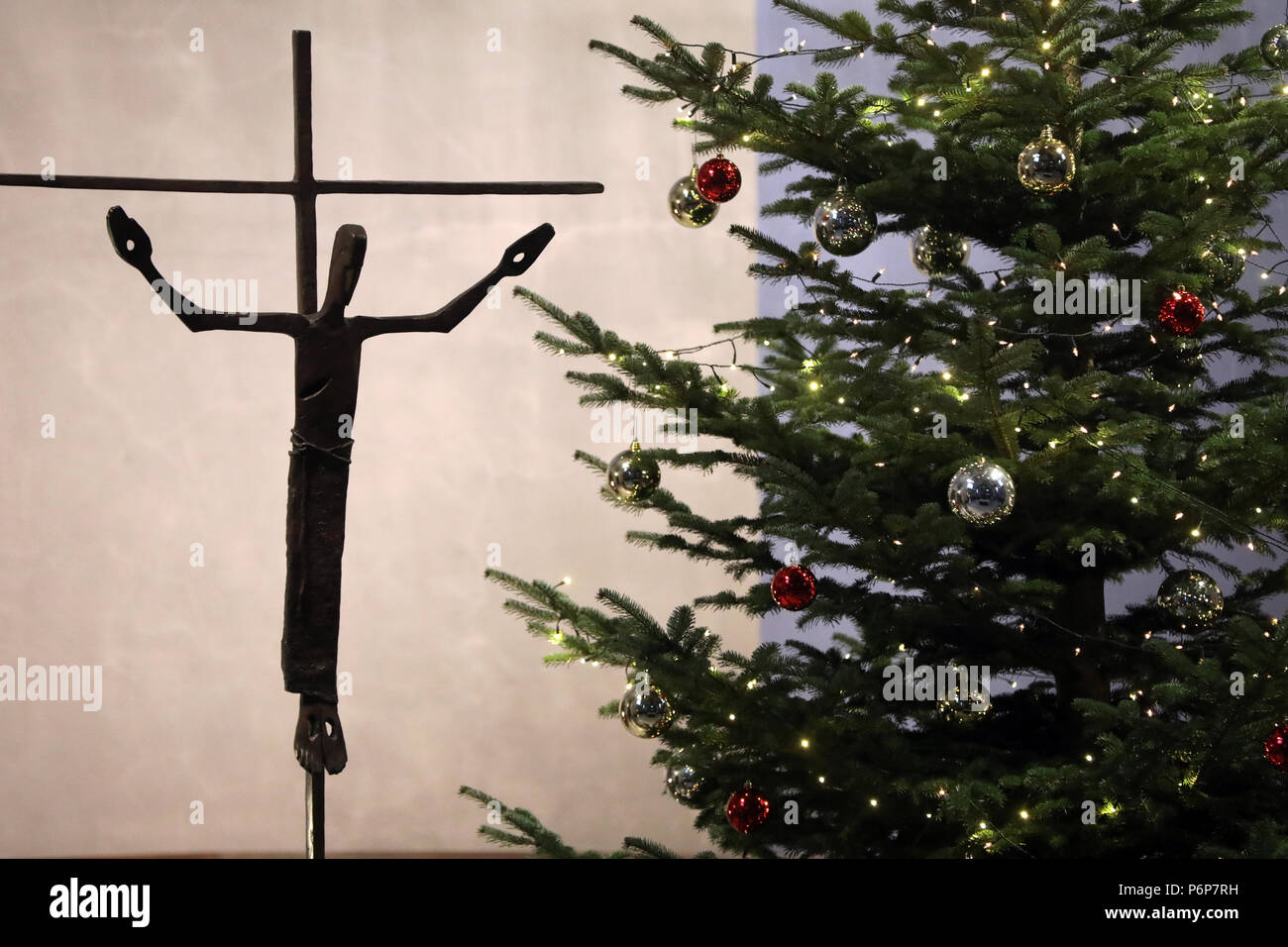 Christmas tree and crucifix in a church.  Basel. Switzerland. Stock Photo