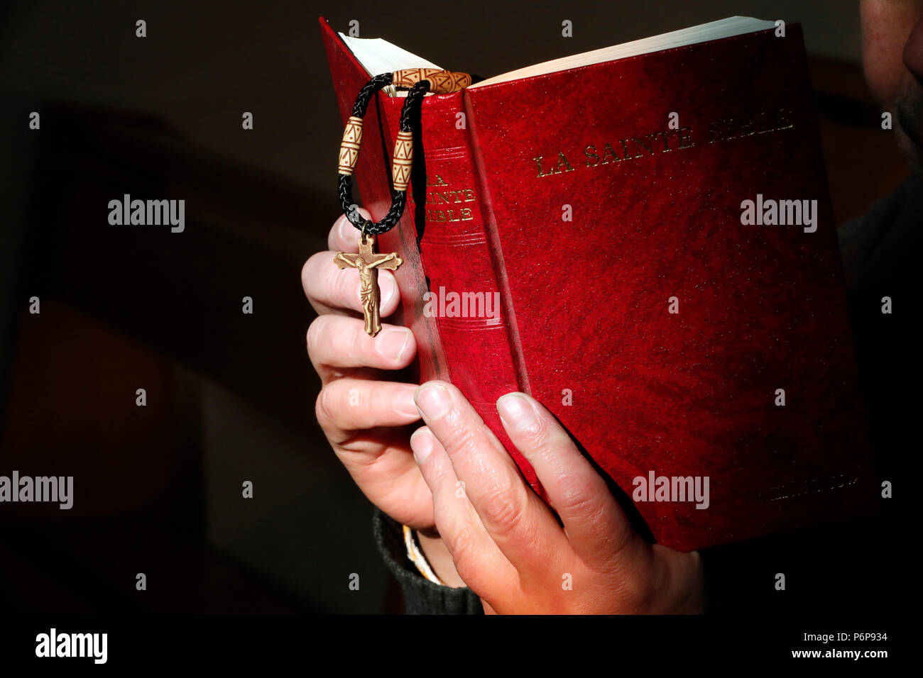 Man reading the bible.  France. Stock Photo