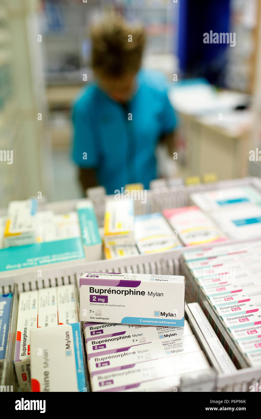 Pharmacy.  Pharmacist taking drug from a drawer cabinet.  France. Stock Photo