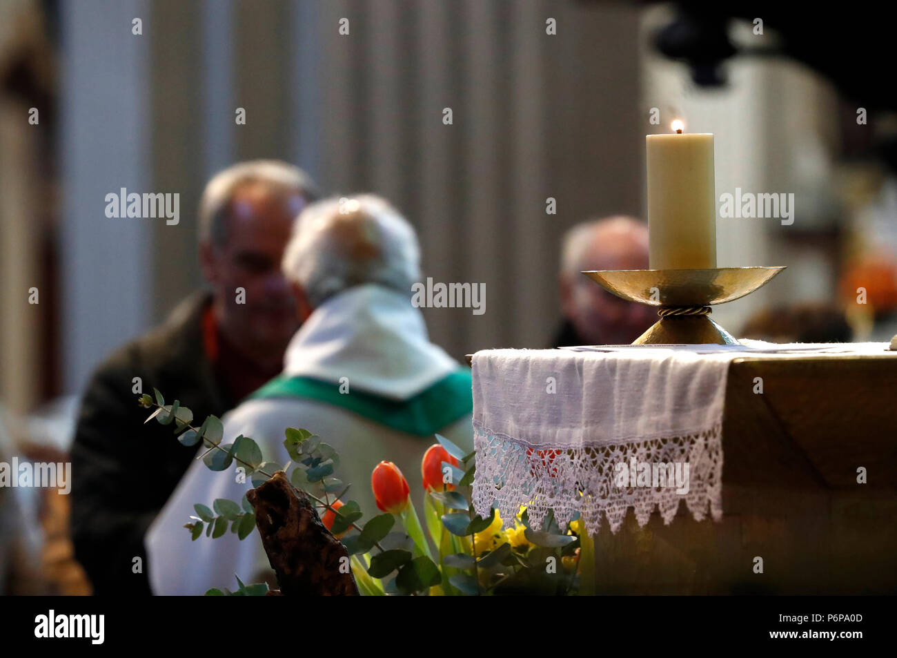 Saint-Jacques church.  Catholic mass.  Priest giving Holy Communion. Sallanches. France. Stock Photo
