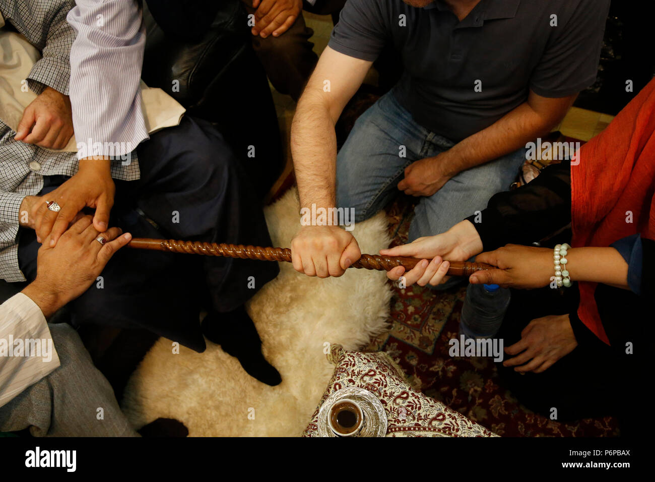 Sufi devotees bonding with Mawlana Sheikh Mehmet Efendi in Saint-Ouen, France. Stock Photo