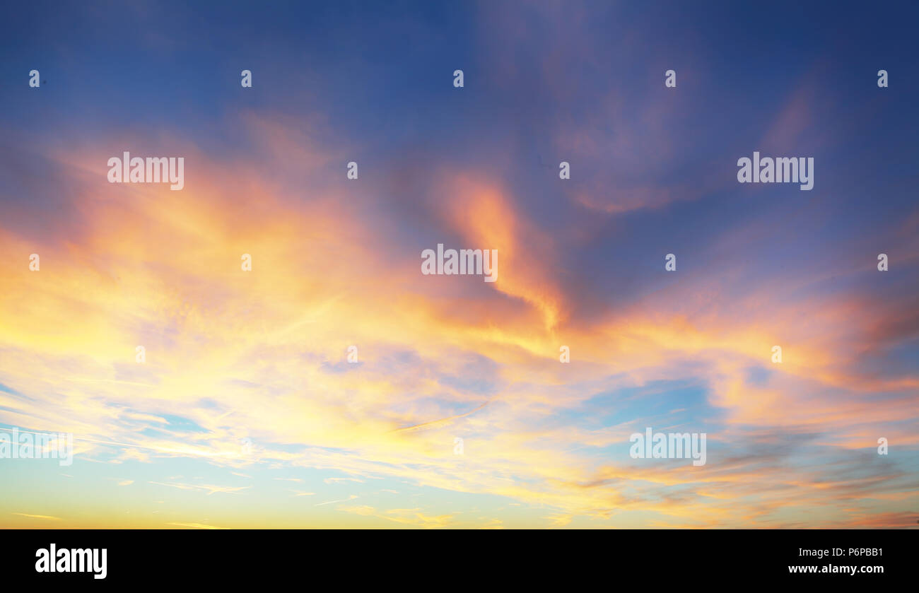 Only sky, dramatic sunset with colorful clouds Stock Photo