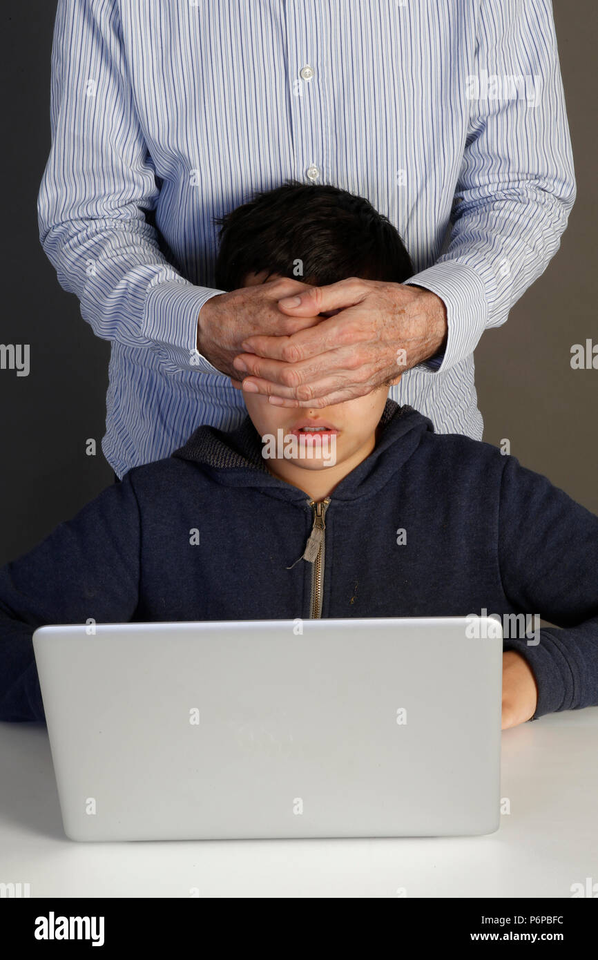 12-year-old boy forbidden to look at an internet site. Paris, France. Stock Photo
