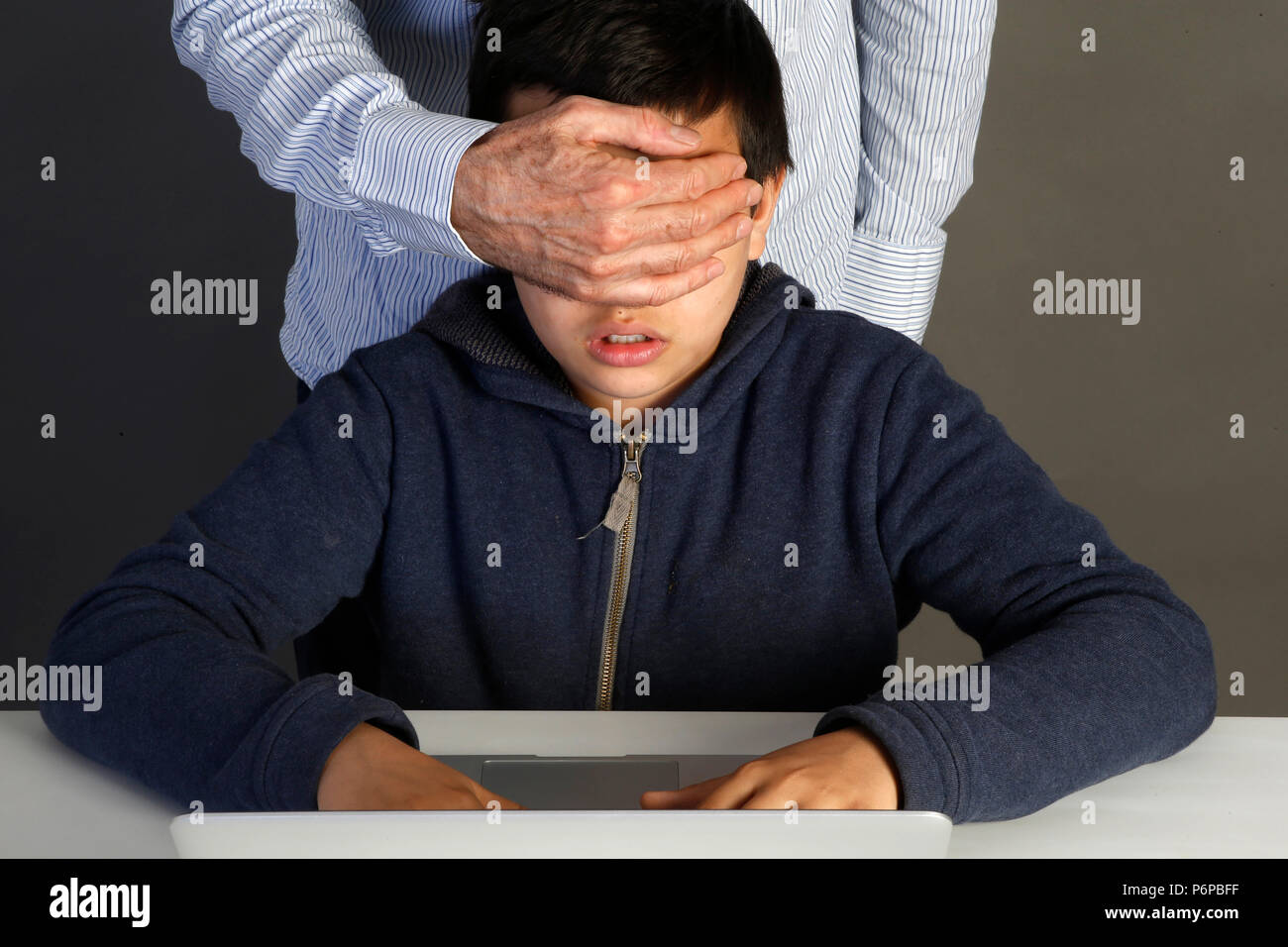 12-year-old boy forbidden to look at an internet site. Paris, France. Stock Photo
