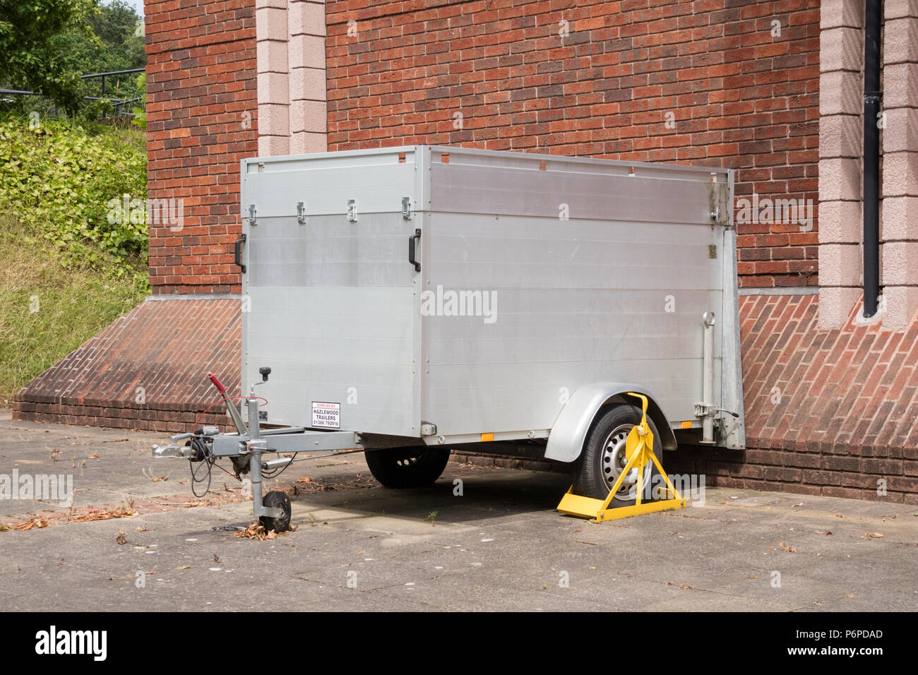 Trailer with wheel lock Stock Photo Alamy