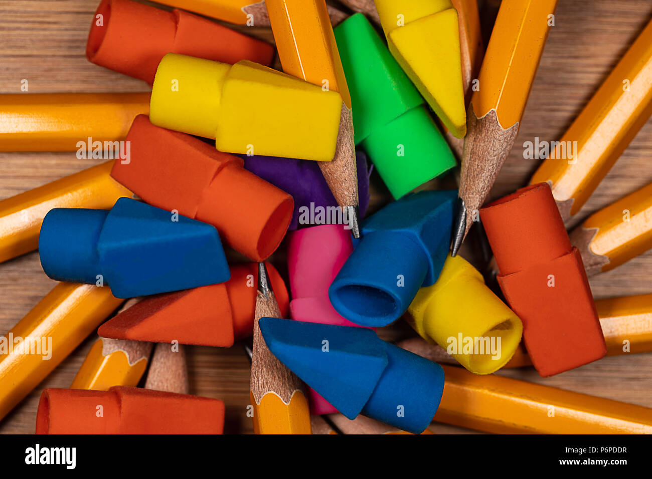 Multicolored Pencil Erasers and Sharpened Pencil points in a pile on a