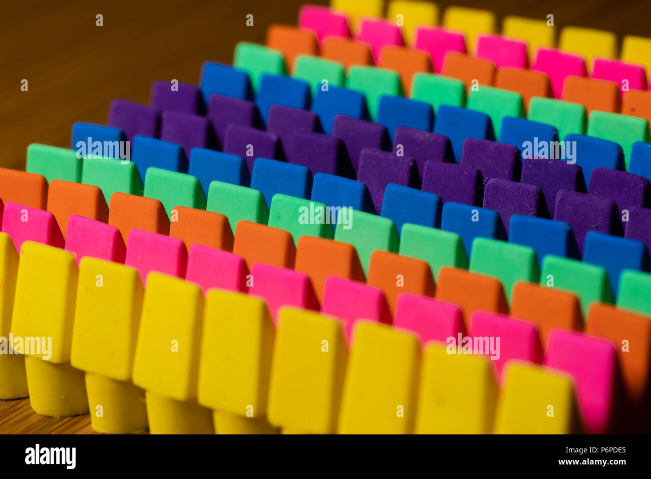 Rows of brightly colored pencil erasers lined up in an OCD orderly