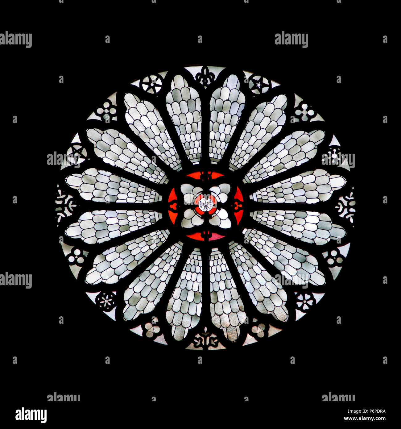 Stained-glass rose window of Trento cathedral, Northern Italy Stock Photo
