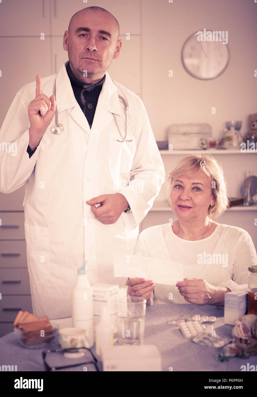 Mature woman calls doctor hi-res stock photography and images - Alamy