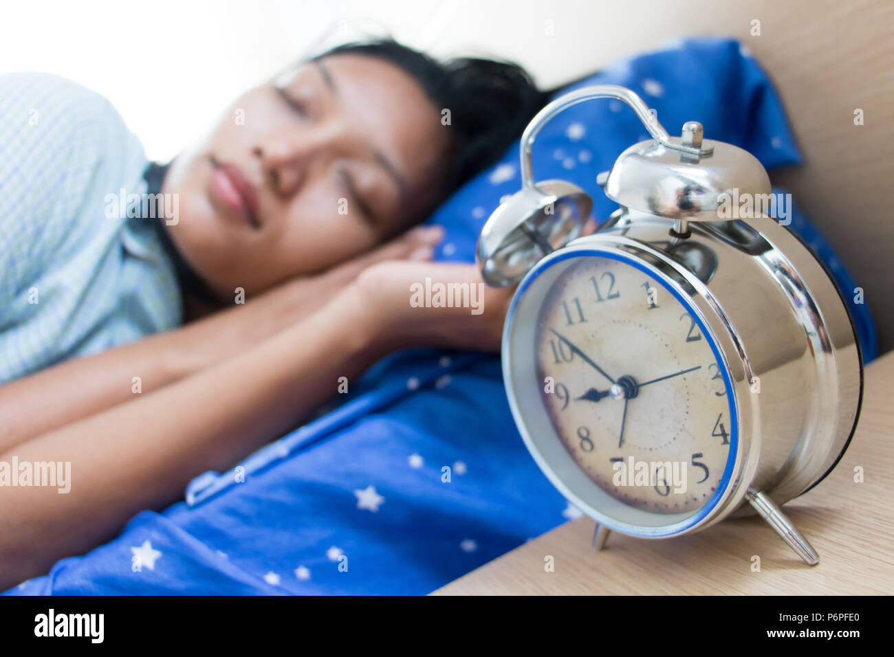 Young woman sleeping in nightgown. The girl is sleeping in bed with an