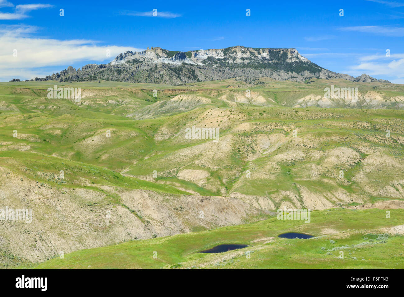 ponds and prairie hills below square butte near geraldine, montana
