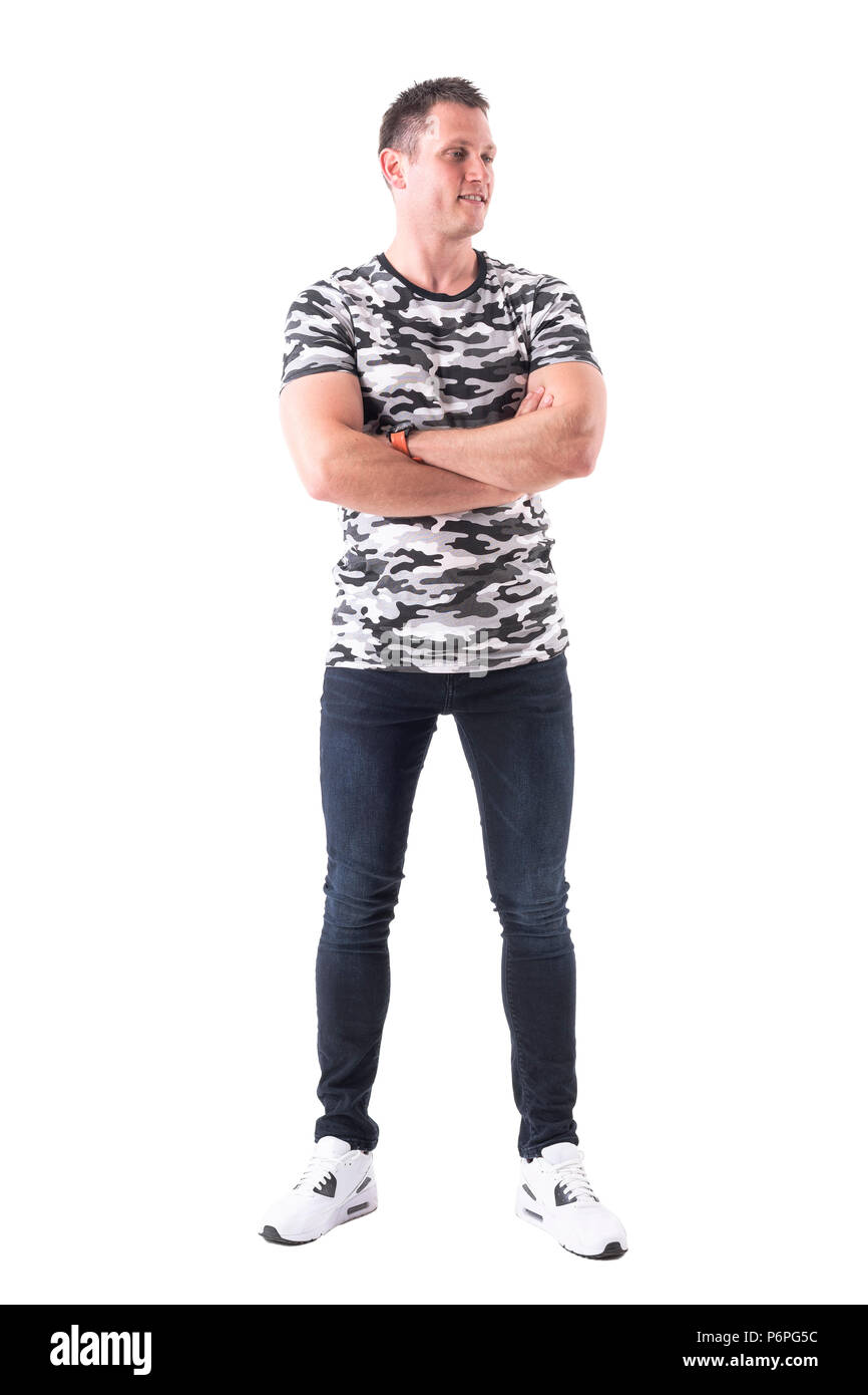 Happy confident smiling man with crossed arms looking away. Full body ...