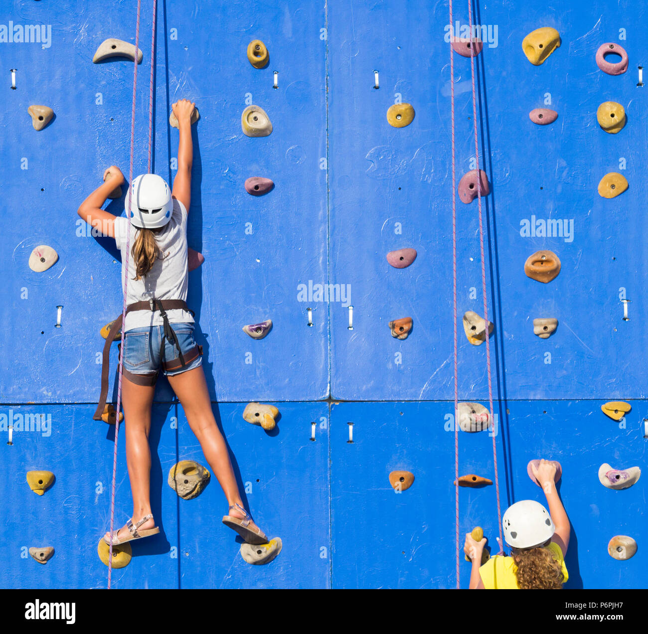 Child on climbing wall hires stock photography and images Alamy