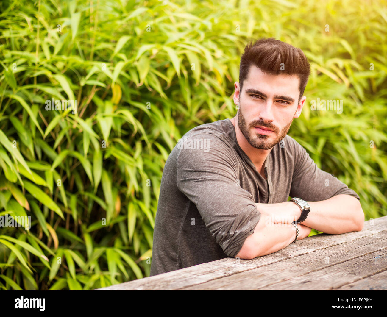 Attractive Young Man In City Park In A Summer Day Stock Photo
