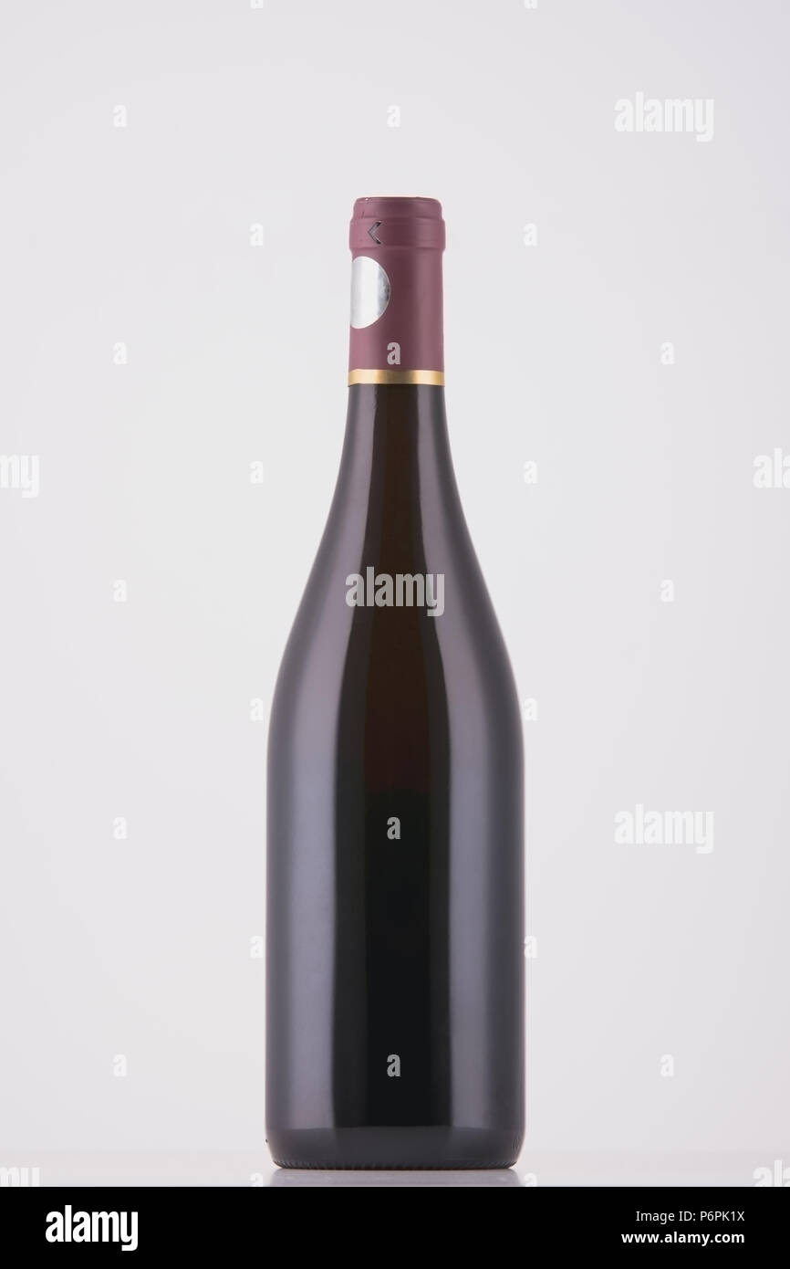 Wine bottle of dark color on white background Stock Photo