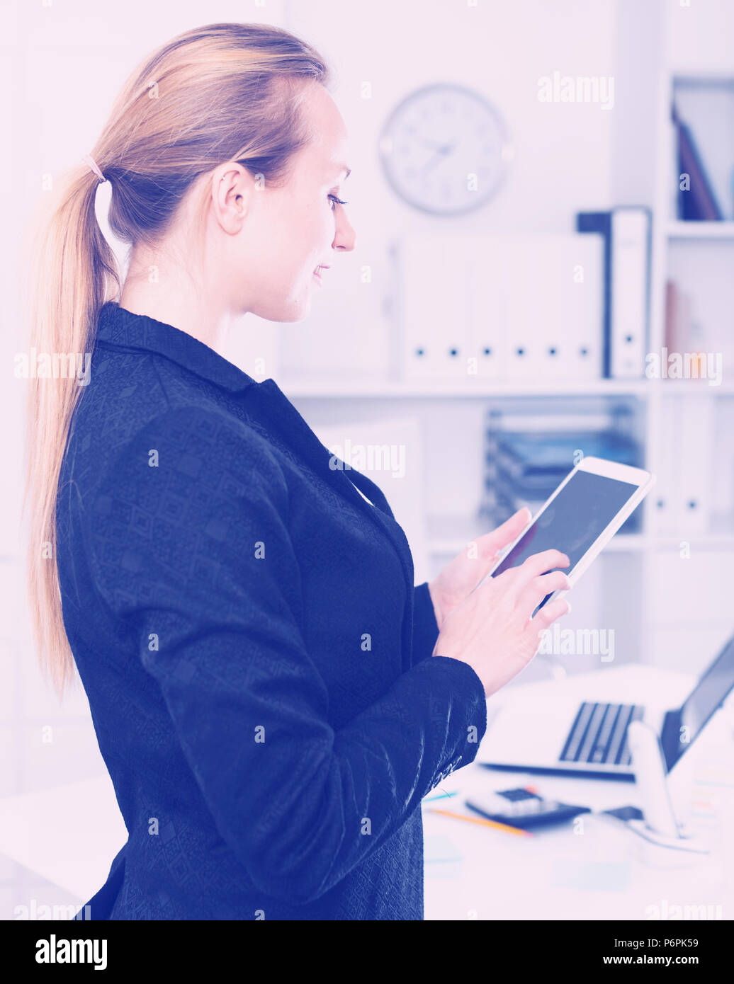 Female Testing Modern Middle Size Touchscreen In The Office Stock Photo female-testing-modern-middle-size-touchscreen-in-the-office-stock-photo