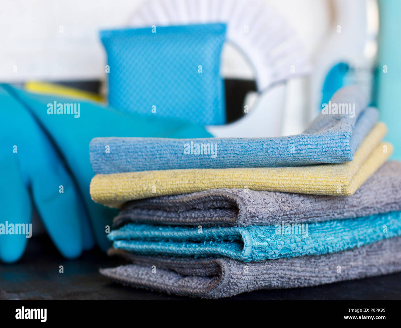 Cleaning stuff. Blue and grey microfiber napkins on the black ground Stock Photo