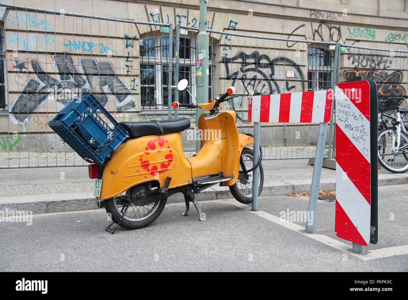 BERLIN, GERMANY - AUGUST 25, 2014: Simson Schwalbe oldtimer scooter parked in Berlin. More than 900 thousand were produced in 1959-1986. Stock Photo