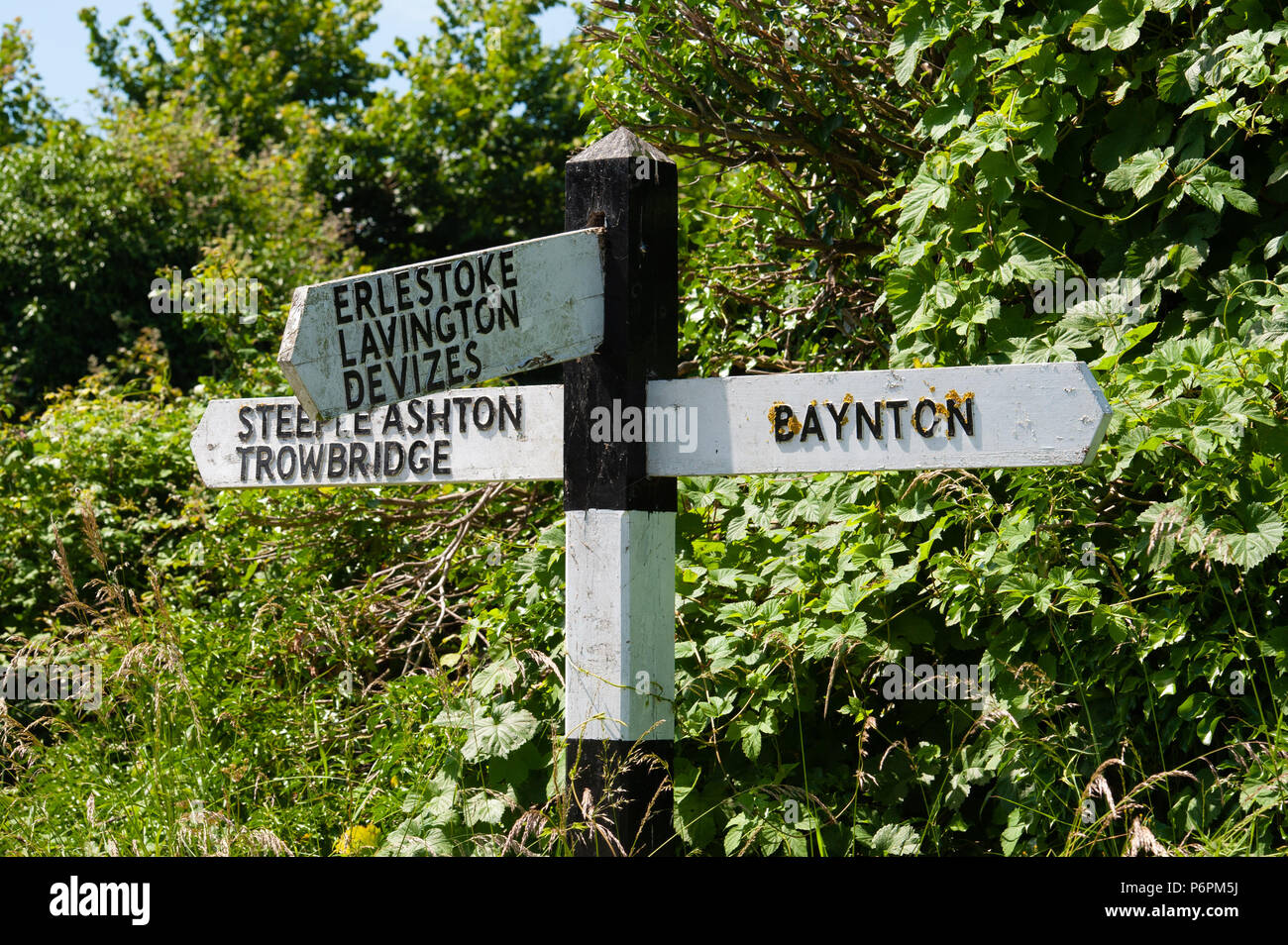 Traditional roadside, black and white signpost in Wiltshire, UK Stock ...