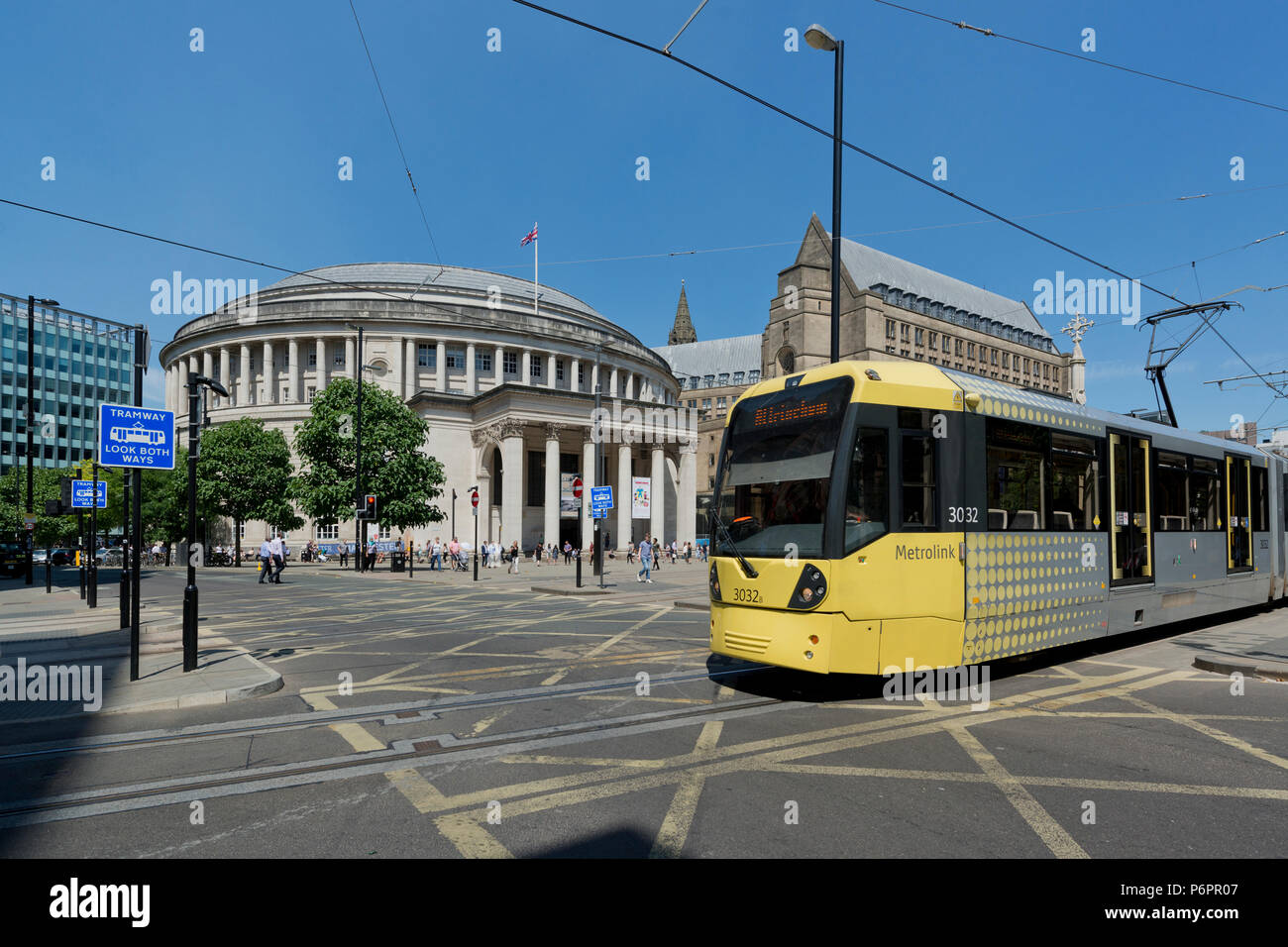 A Metrolink tram passes infront of the Central Library in St Peter's Sqaure in Manchester. Stock Photo