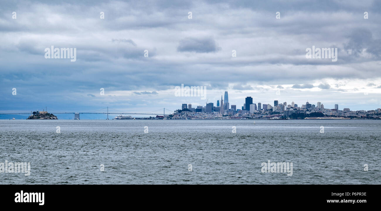 A view of downtown San Francisco as seen from the waterfront in Sausalito on an gloomy and overcast summer day. Stock Photo