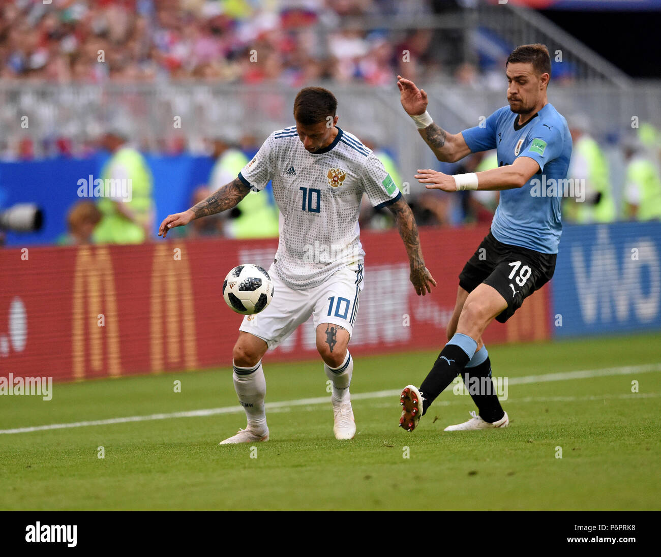 Samara, Russia - June 25, 2018. Uruguayan defender Sebastian Coates and Russian striker Fedor Smolov during FIFA World Cup 2018 match Uruguay vs Russi Stock Photo