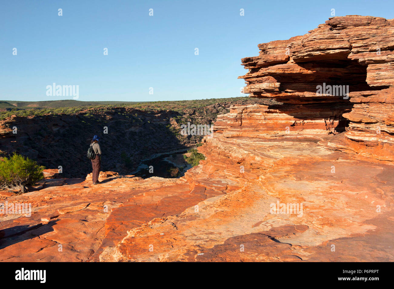 Woman looking over the Murchison Gorge from Nature's window, Kalbarri National Park,  Western Australia Stock Photo