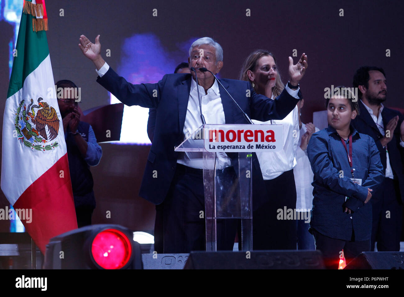 Mexico City, Mexico. 2nd July, 2018. Mexico's presidential candidate for the coalition 'Together We Will Make History' Andres Manuel Lopez Obrador (C) gives a speech at Zocalo Square in Mexico City, capital of Mexico, on July 2, 2018. Leftist candidate Andres Manuel Lopez Obrador has topped his rivals with 43.93 percent of votes, early result for the presidential elections in Mexico showed Sunday night. Credit: Ricardo Aldayturriaga/Xinhua/Alamy Live News Stock Photo
