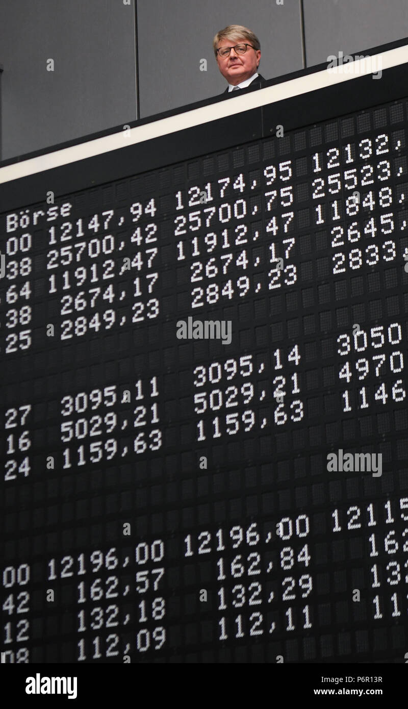 Frankfurt, Germany. 02nd July, 2018. Chairman of the Deutsche Boerse AG, Theodor Weimer (L-R), Frank Mella, standing over a display board with the indexes of the German stock exchange for the 30 year anniversary of the DAX. Thirty years after its introduction, the German lead index is one of the most significant market indicators in the world and, despite a few set backs, a success story. Since the first trading day on the 1 July 1988 with 1163 points, the German stock index has strongly increased, at times by more than 13,000 points. Credit: Arne Dedert/dpa/Alamy Live News Stock Photo
