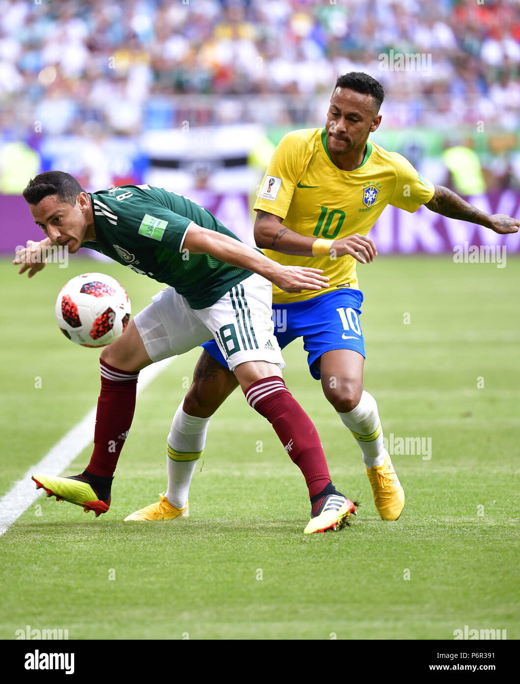 Samara, Russia. 2nd July, 2018. Neymar (R) of Brazil vies with Andres Guardado of Mexico during the 2018 FIFA World Cup round of 16 match between Brazil and Mexico in Samara, Russia, July 2, 2018. Credit: Chen Yichen/Xinhua/Alamy Live News Stock Photo