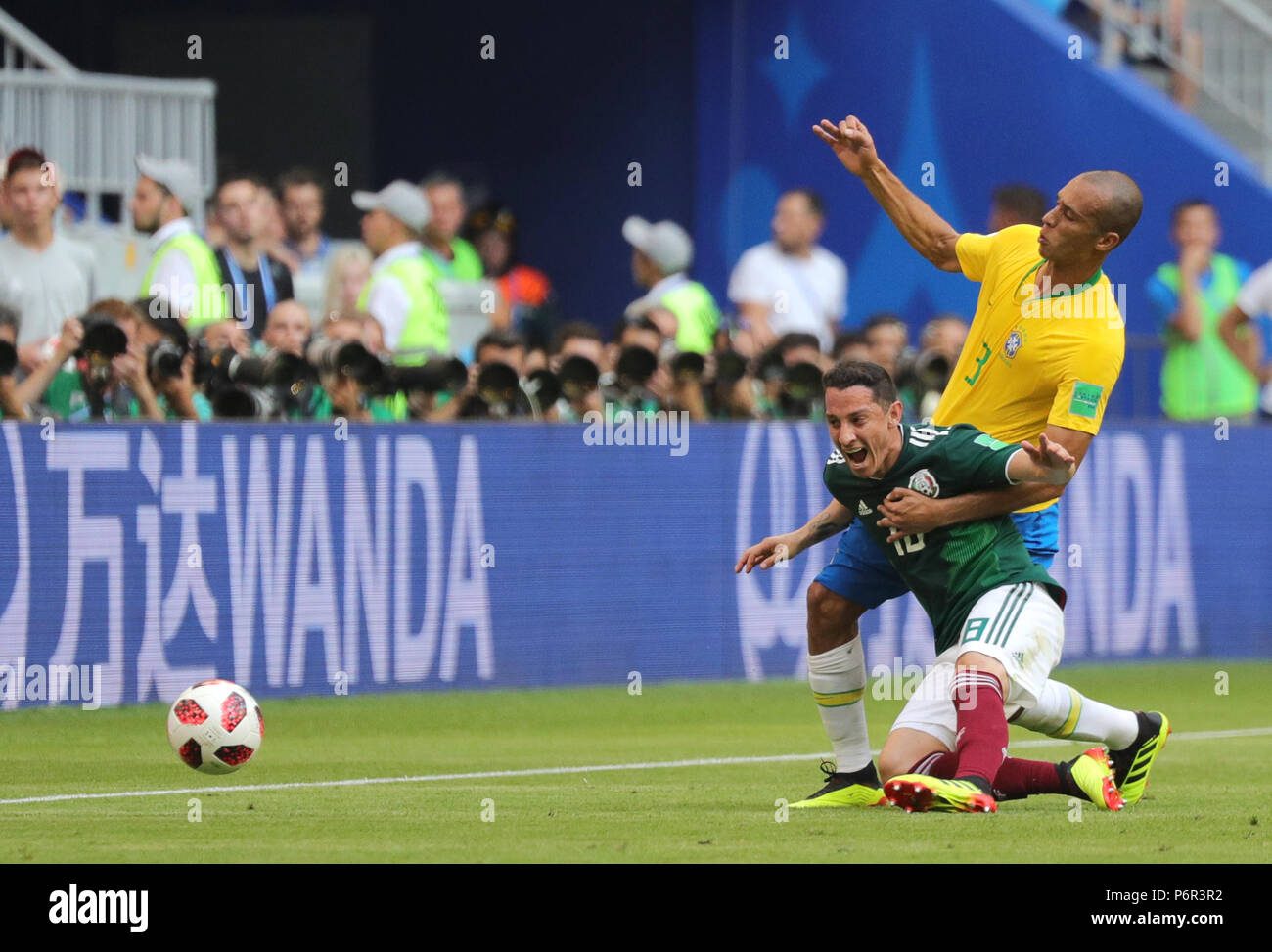 Samara, Russia. 02nd July, 2018. Soccer, World Cup 2018, Final Round - Round of 16: Mexico vs. Brazil at the Samara Stadium: Brazil's Miranda (R) and Mexico's Andres Guardado vying for the ball. Credit: Christian Charisius/dpa/Alamy Live News Stock Photo