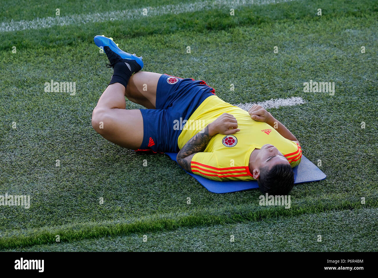 Moscow, Russia. 2nd July 2018. James Rodriguez of Colombia sits out and stretches during a Colombia training session, prior to their 2018 FIFA World Cup Round of 16 match against England, at Spartak Stadium on July 2nd 2018 in Moscow, Russia. Credit: PHC Images/Alamy Live News Stock Photo