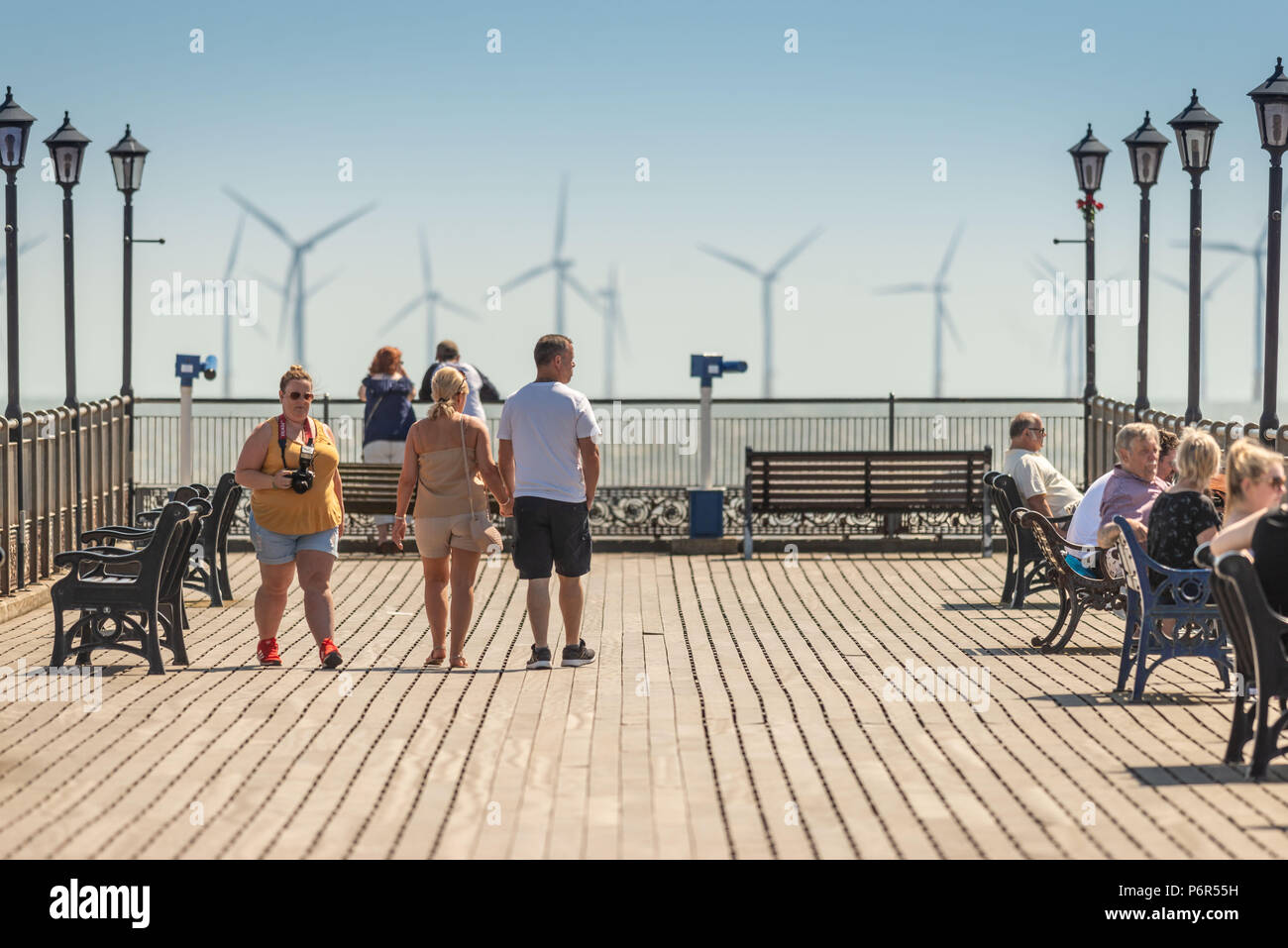 Skegness, UK. 2nd July 2018. Tourists enjoying the hot weather on Skegness Pier and viewing the offshore wind farms through the heat haze on the East Coast towards the usually cold North Sea. Credit: Steven Booth/Alamy Live News. Stock Photo