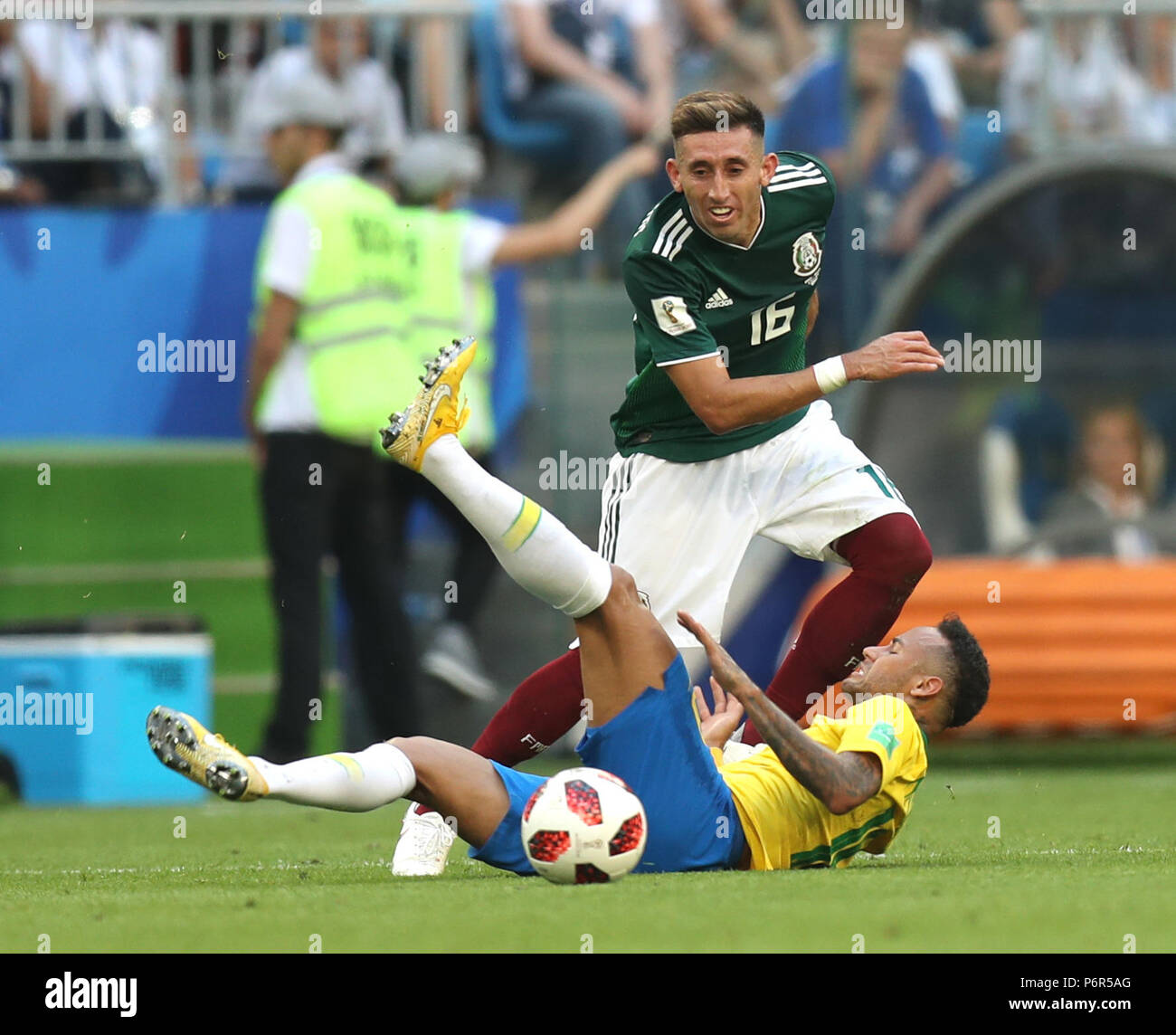 Samara, Russia. 2nd July, 2018. Neymar (bottom) of Brazil vies with Hector Herrera of Mexico during the 2018 FIFA World Cup round of 16 match between Brazil and Mexico in Samara, Russia, July 2, 2018. Credit: Lu Jinbo/Xinhua/Alamy Live News Stock Photo