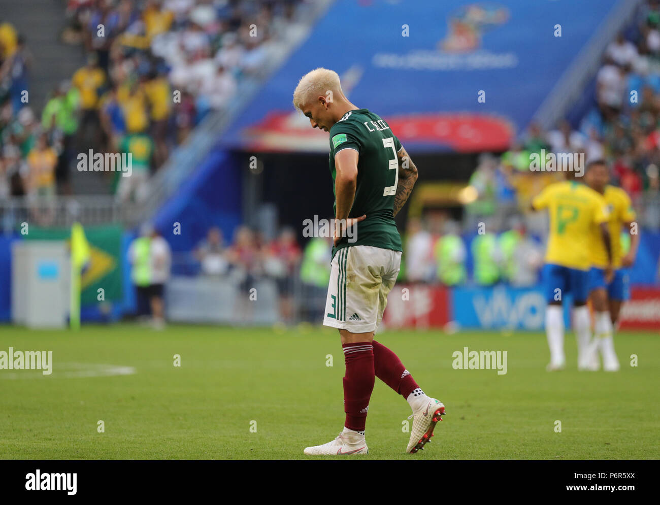 Samara, Russia. 02nd July, 2018. Soccer, World Cup 2018, Final round - round of 16: Mexico vs. Brazil at the Samara stadium: Mexico's Carlos Salcedo walking disappointed across the field after Mexico conceded a goal. Credit: Christian Charisius/dpa/Alamy Live News Stock Photo