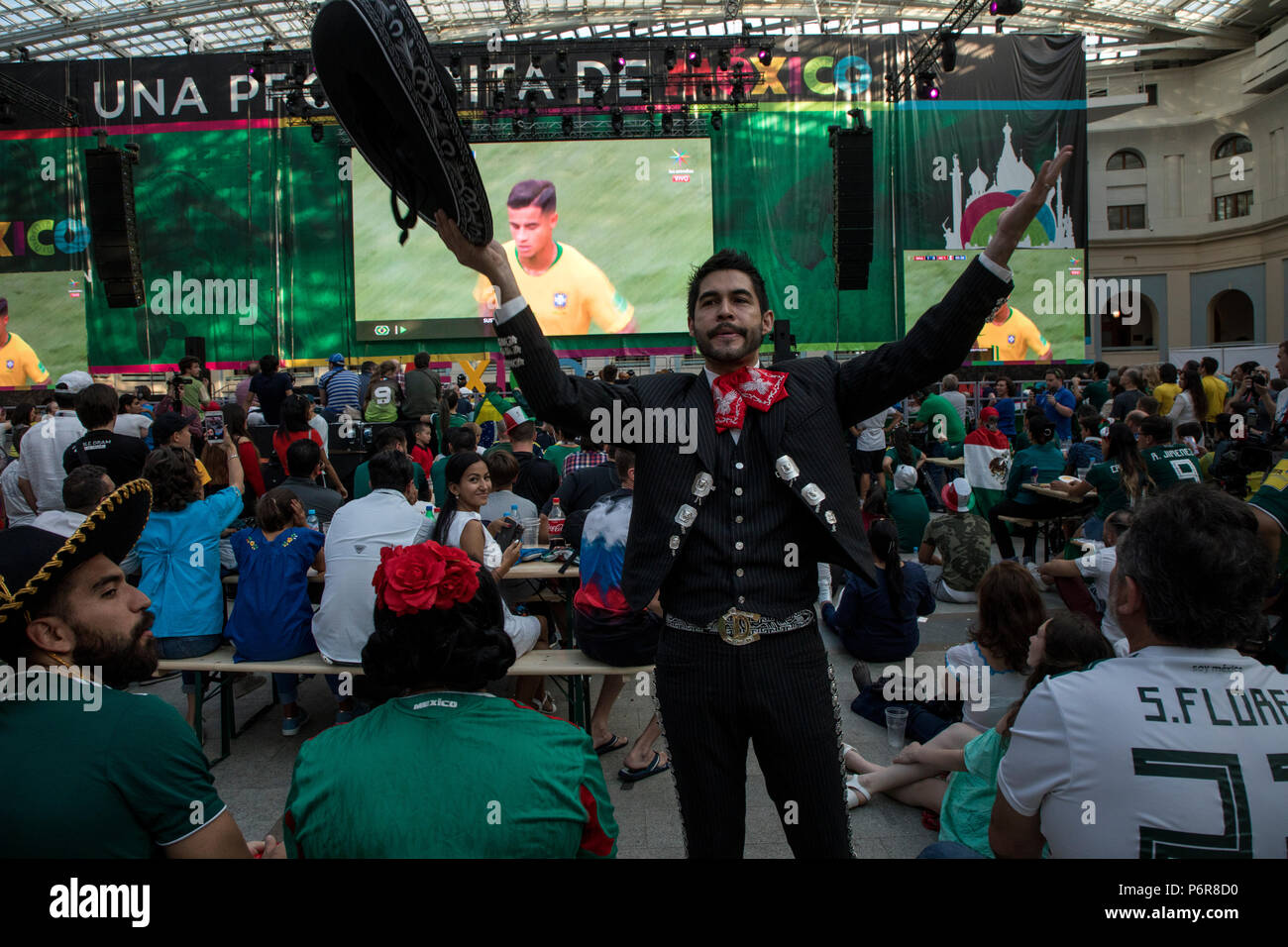 Moscow, Russia. 2nd July, 2018. A Mexican fans watch the round of 16 match between Brazil and Mexico at the World Cup FIFA 2018 in the Samara Arena, at the big screen in Mexican fan house in central Moscow, Russia Credit: Nikolay Vinokurov/Alamy Live News Stock Photo