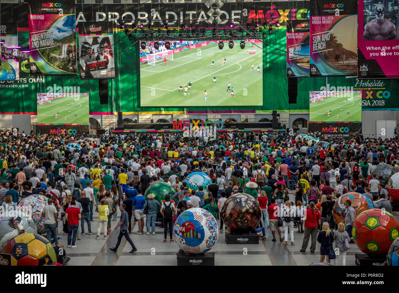 Moscow, Russia. 2nd July, 2018. A Mexican fans watch the round of 16 match between Brazil and Mexico at the World Cup FIFA 2018 in the Samara Arena, at the big screen in Mexican fan house in central Moscow, Russia Credit: Nikolay Vinokurov/Alamy Live News Stock Photo