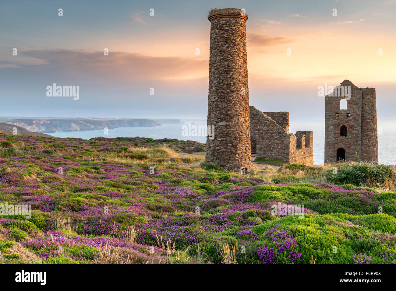 Wheal Coates, Cornwall. 2nd July, 2018. UK Weather - After another warm and humid  day the high cloud breaks to give a spectacular  sunset over the heather and gorse at Wheal Coates, deep in the heart of the 'Poldark' county of North Cornwall. Credit: Terry Mathews/Alamy Live News Stock Photo