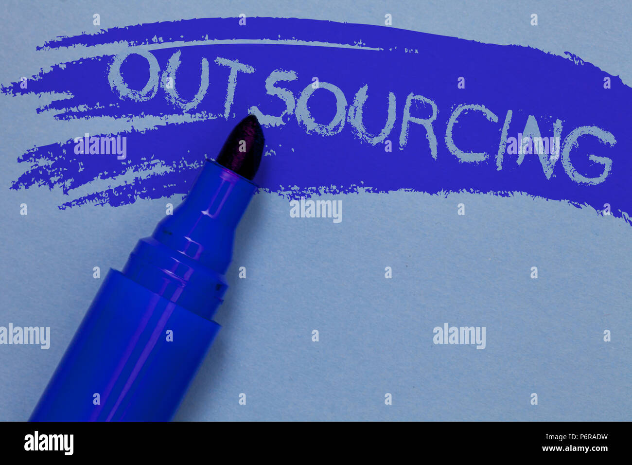 Writing note showing Outsourcing. Business photo showcasing Obtain goods or service by contract from an outside supplier Bold blue marker colouring sk Stock Photo