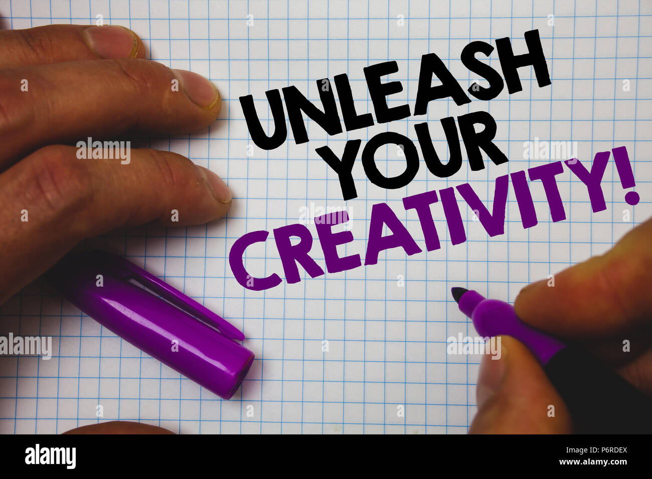 Text sign showing Unleash Your Creativity Call. Conceptual photo Develop Personal Intelligence Wittiness Wisdom Man hold holding purple marker noteboo Stock Photo