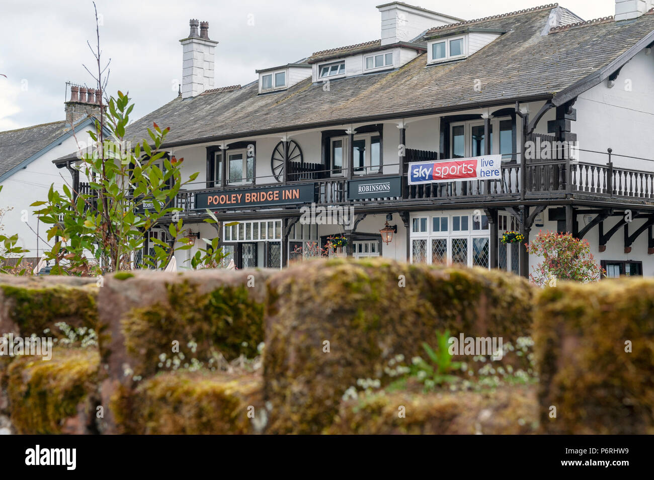 Building of Pooley Bridge Inn, a local family run accommodation located in the center of Pooley Bridge village near Ullswater Lake Stock Photo