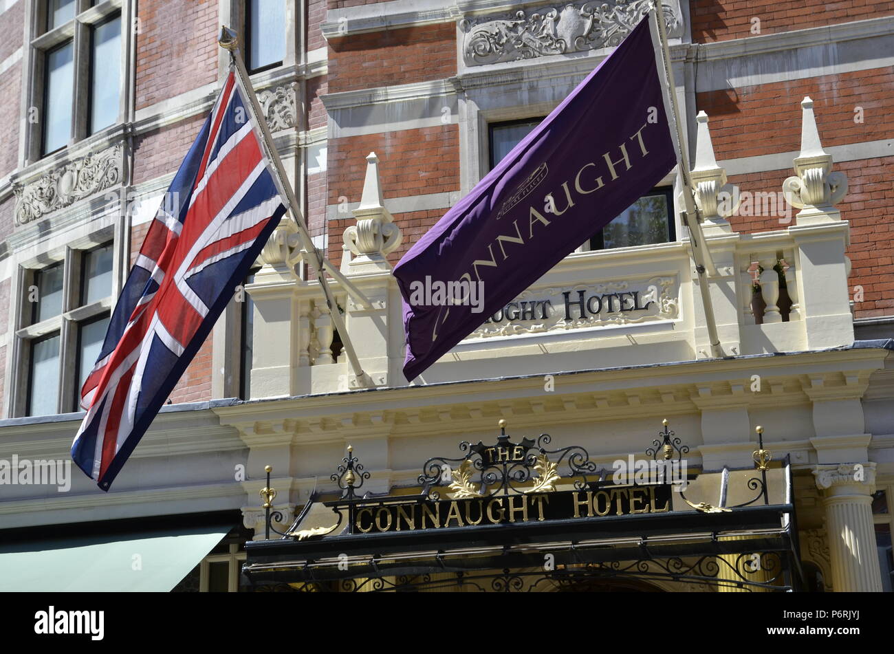 Flags at the entrance to the Connaught Hotel in Mayfair, London Stock Photo