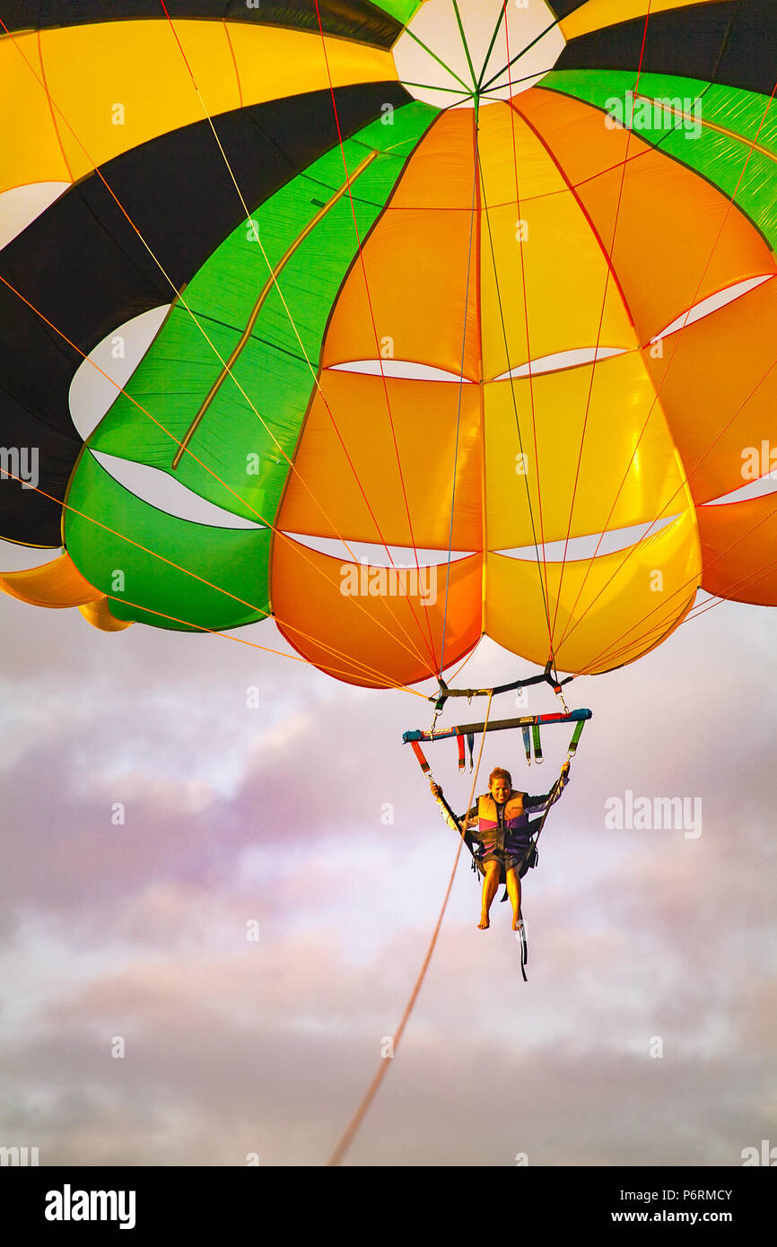 Parasailing over White Beach at Puerto Galera, Oriental Mindoro Island, Philippines. Stock Photo