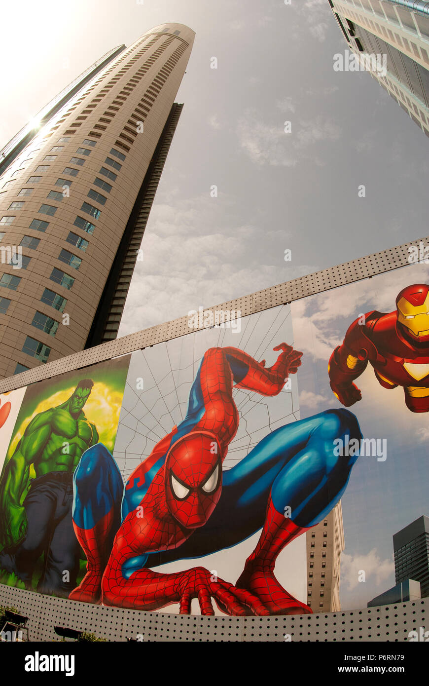 Giant Super-Hero poster with superhero looking down to stree level Stock Photo