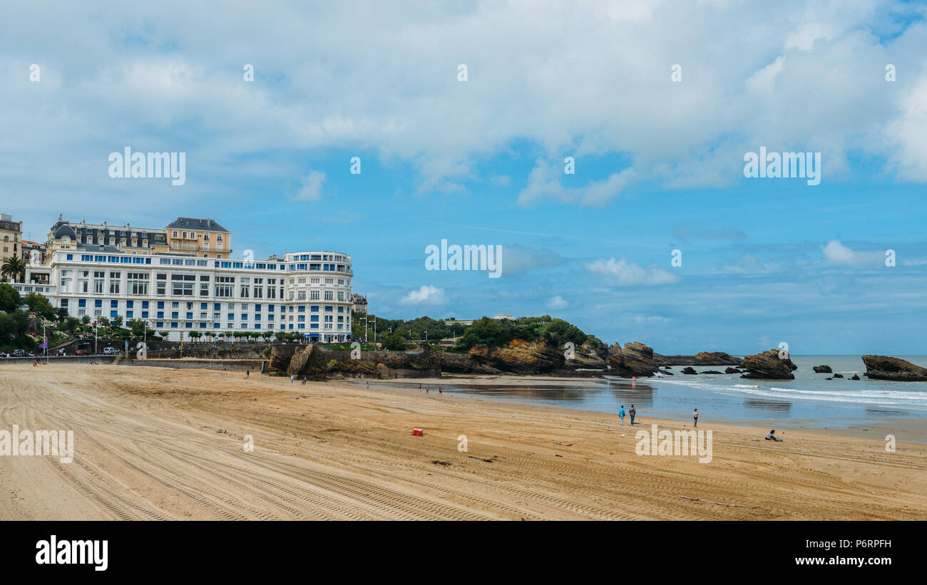 Families relax at the Grande Plage beach in Biarritz, Aquitaine France, a popular resort town on the Bay of Biscay Stock Photo